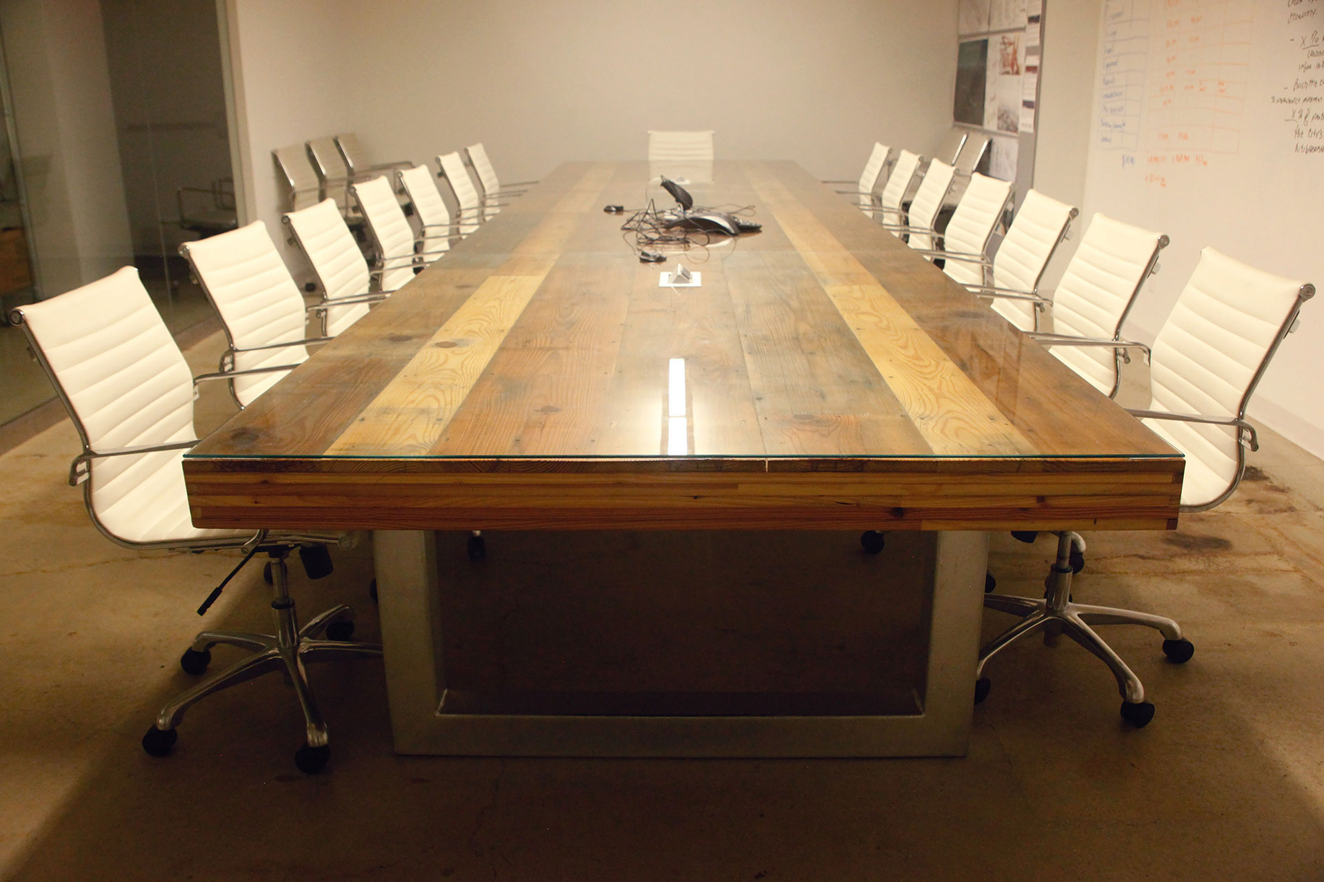 Conference room, custom table with reclaimed wood top, custom steel table bases.