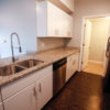 Pre-fabricated cabinets and granite countertops. Installation of wood base, casings and doors.