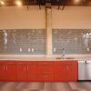 Plastic laminate cabinets, with solid surface countertops.