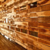 Custom wood framing and reclaimed wood/slat walls and ceiling.
